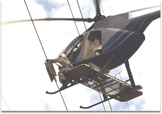 AR Windamper being installed on a transmission line using a helicopter