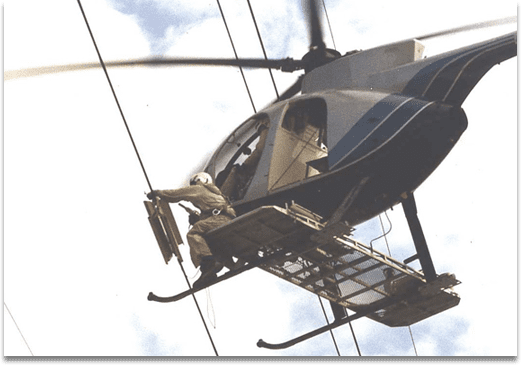 Product Installations AR Windamper being installed on a transmission line using a helicopter